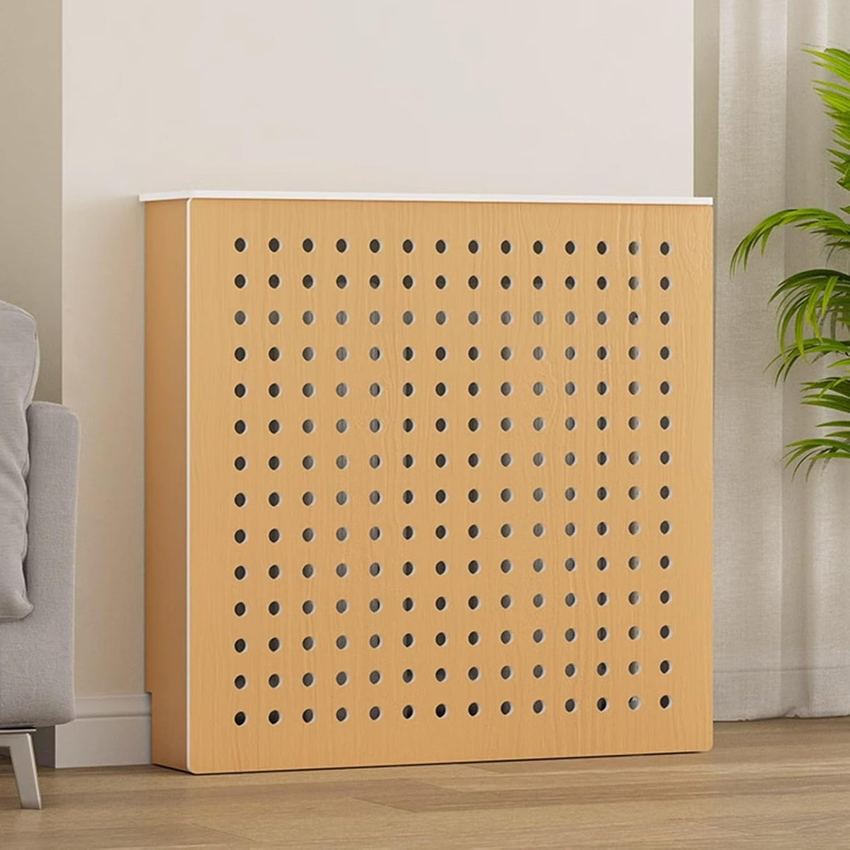 Un dispositif de chauffage a surface permeable a la vapeur en coloris beige et orange