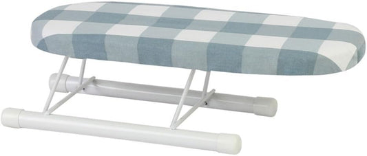 Une planche de table reunit une structure pliante et un format compact